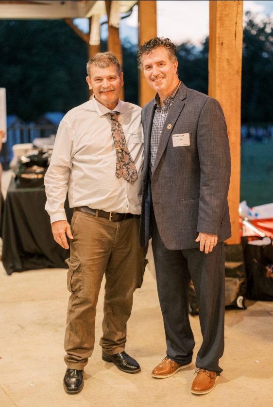 Executive Director Rick Callahan (right) and Compass participant Greg.