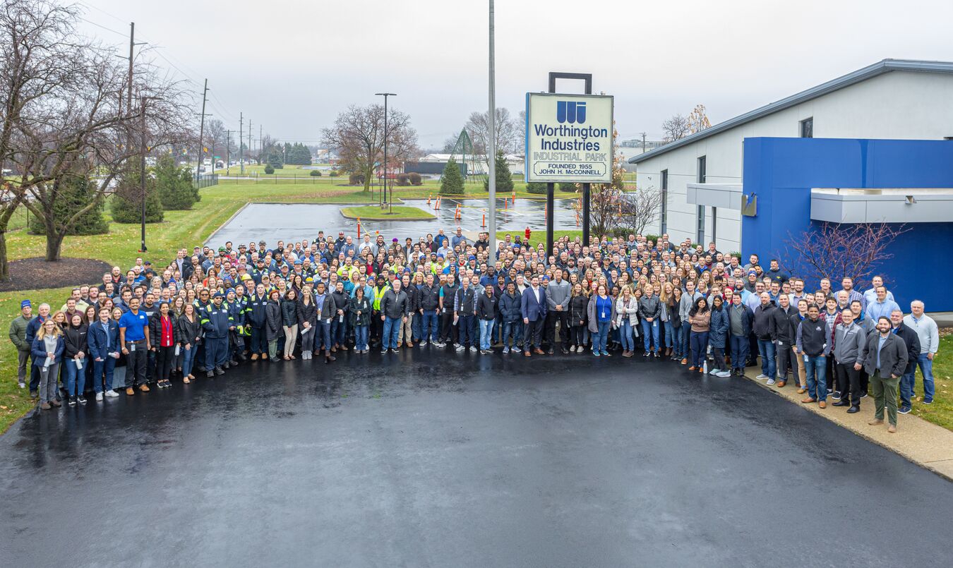 In celebration of the legal separation of Worthington Industries into Worthington Enterprises and Worthington Steel, employees celebrated with activities throughout the day including food trucks, photo booths and group pictures in front of a historical Worthington Industries sign.