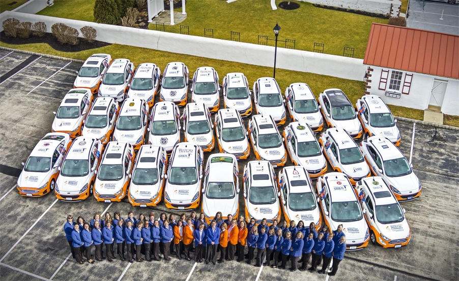 GroupInFrontofCars_2025.jpg
