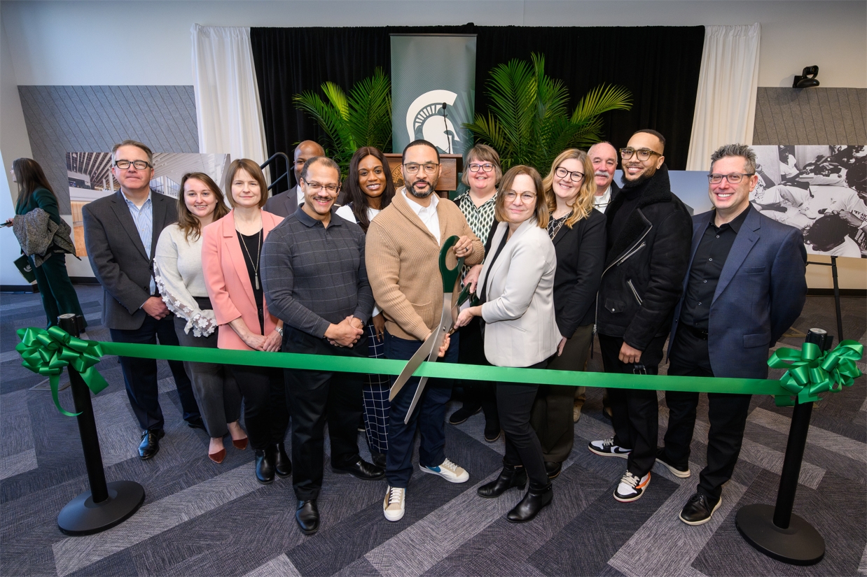 SmithGroup employees celebrate a recent ribbon-cutting at Michigan State University