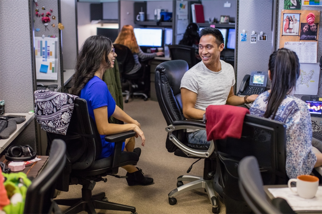 Ambry employees chat in the office