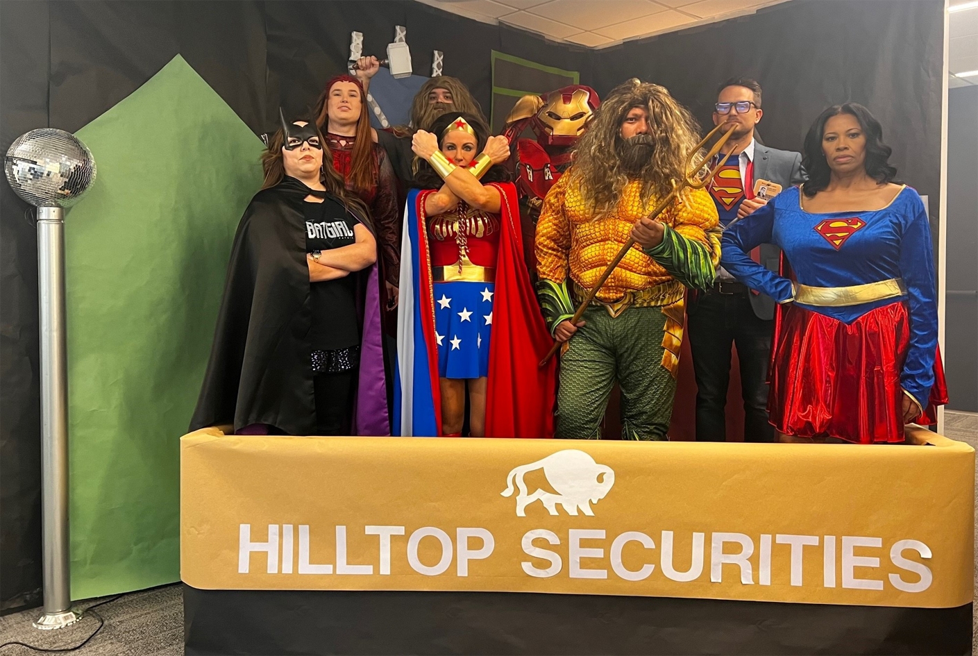 We work hard and play hard at HilltopSecurities! Having fun together is an important part of our corporate culture. Every Halloween, our employees go all out with their costumes and decorations to celebrate the day. Last year, our Clearing department were the real heroes with their amazing costume and full superhero set!