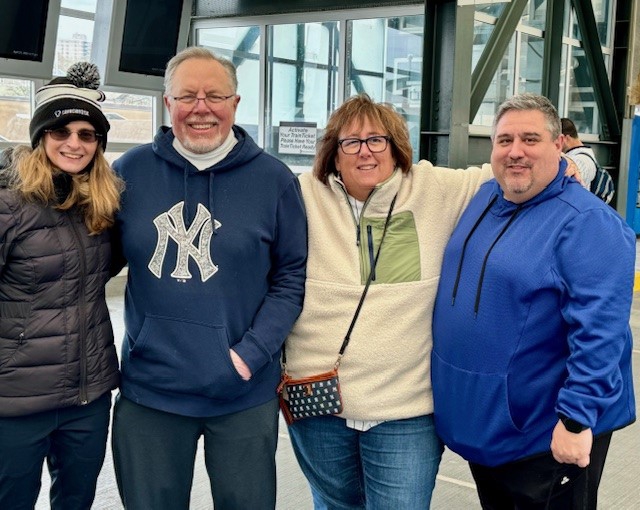 Team Members having fun cheering on the NY Yankees!