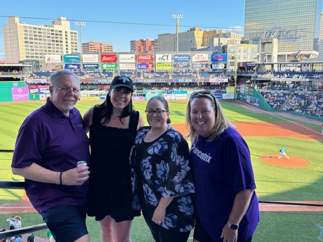 Team members having fun cheering on the Hartford Yard Goats!