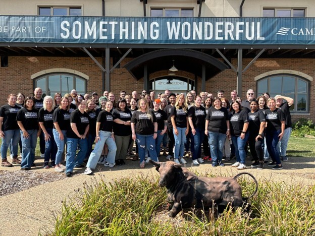 Making an impact in the community is truly ‘Something Wonderful’. Here members of Cambridge’s Advocacy and Supervision department pose in front of the firm’s ‘Something Wonderful’ banner before a team volunteer outing.