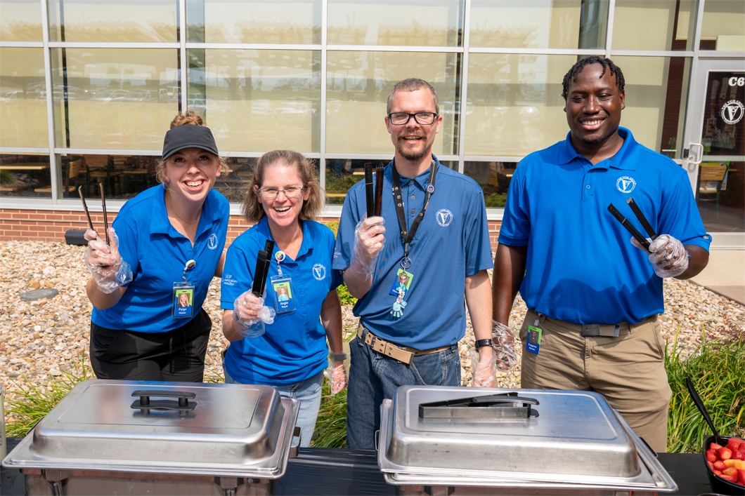 Members of VGM's ESOP Communication Committee prepare to serve lunch as part of  the annual ESOP Grill Out.