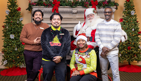 Athletics staff with Santa at the Annual Christmas party with