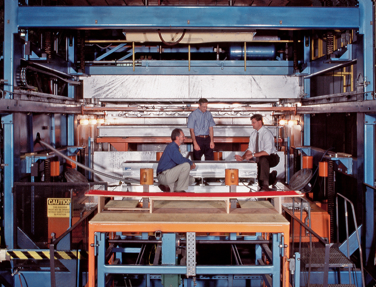 Team working on a mold in a machine copy.jpg
