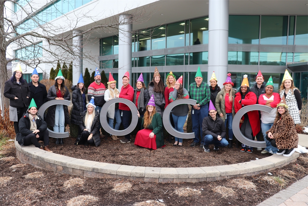 The Business Intelligence group celebrates with a team photo outside our headquarters during the 2022 holiday party