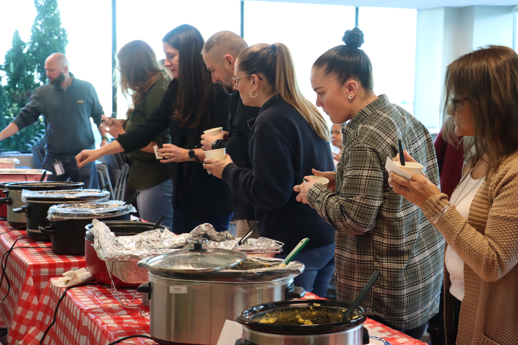 Employees sample and vote on the best dishes at the Military ERG-sponsored mac 'n' cheese cookoff