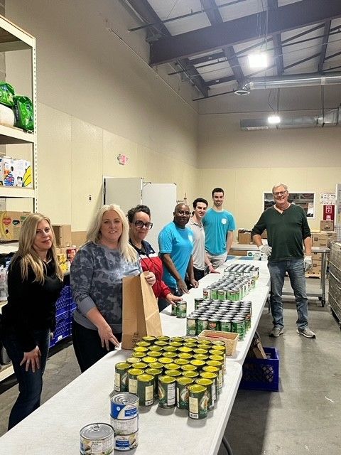 2024-03 Colleagues Volunteering at Food Bank.jpeg