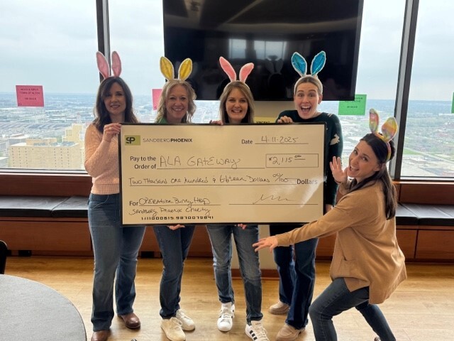 SP group with check.jpg