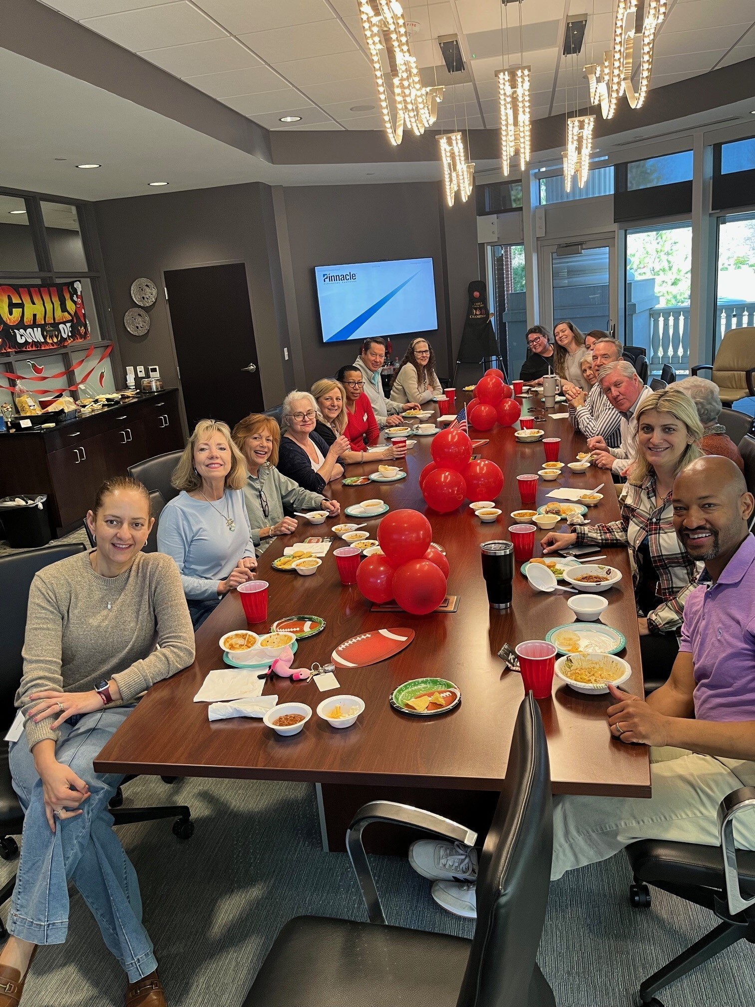 Annual firmwide events like the Chili Bowl Cookoff prior to the NFL championship game bring team members closer together.