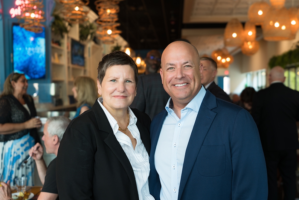 BHHS Chicago CEO, Diane Glass with President and CEO of HomeServices of America, Chris Kelly, at the Q2 Top Producers Breakfast.jpg