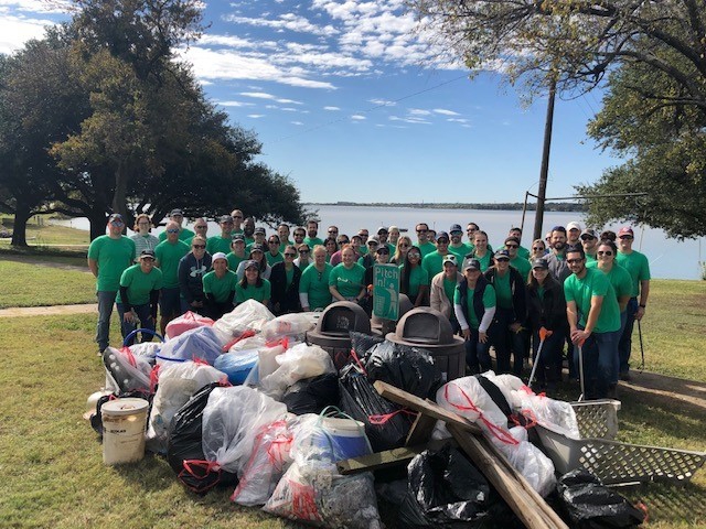 Merit Energy employees clean up White Rock Lake while volunteering with For the Love of the Lake.