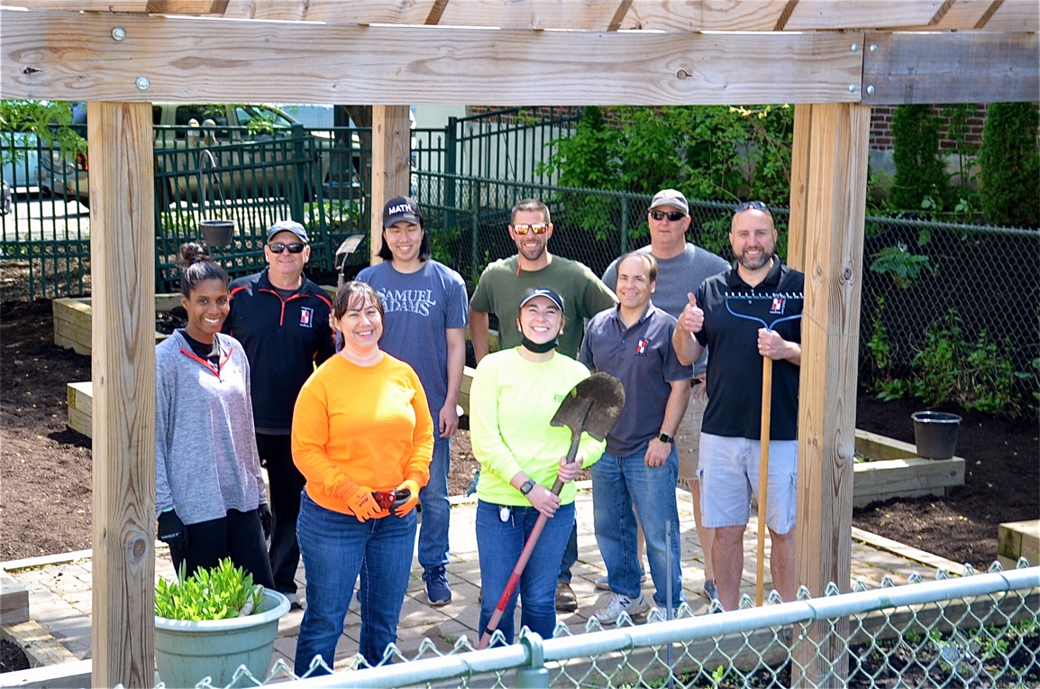 Isett Volunteers Mulching a Community Garden