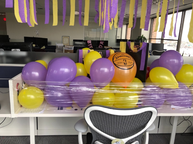 An employee's desk was covered by a co-worker showing off Laker pride in a Spurs nation.