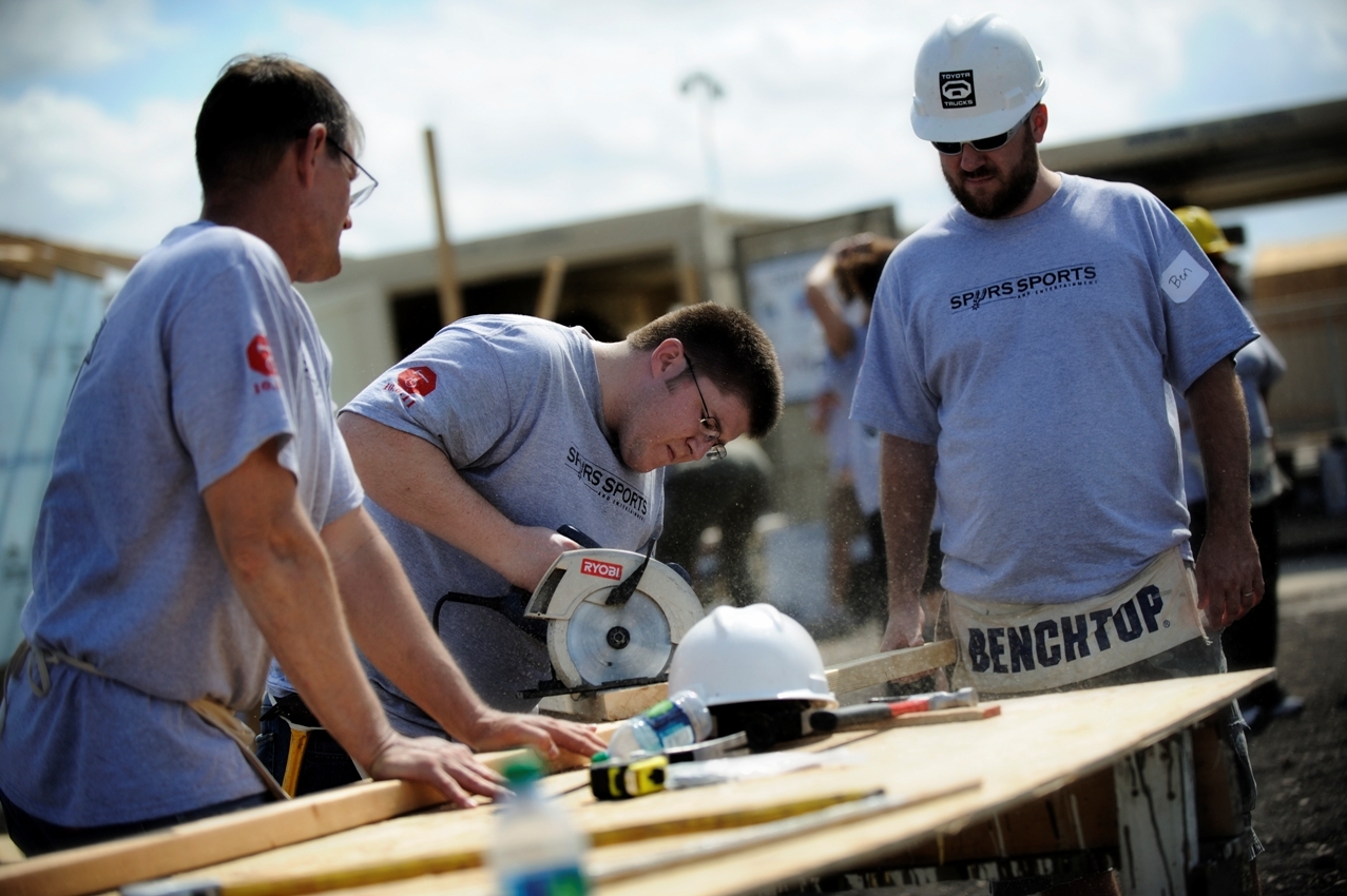 Spurs Sports & Entertainment employees Wayne Webster, Matt Benson and Ben Hunt work together on building a Habitat for Humanity house.