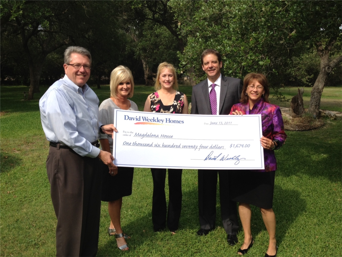 David Weekley Homes presents check of funds raised for the Magdalena House!