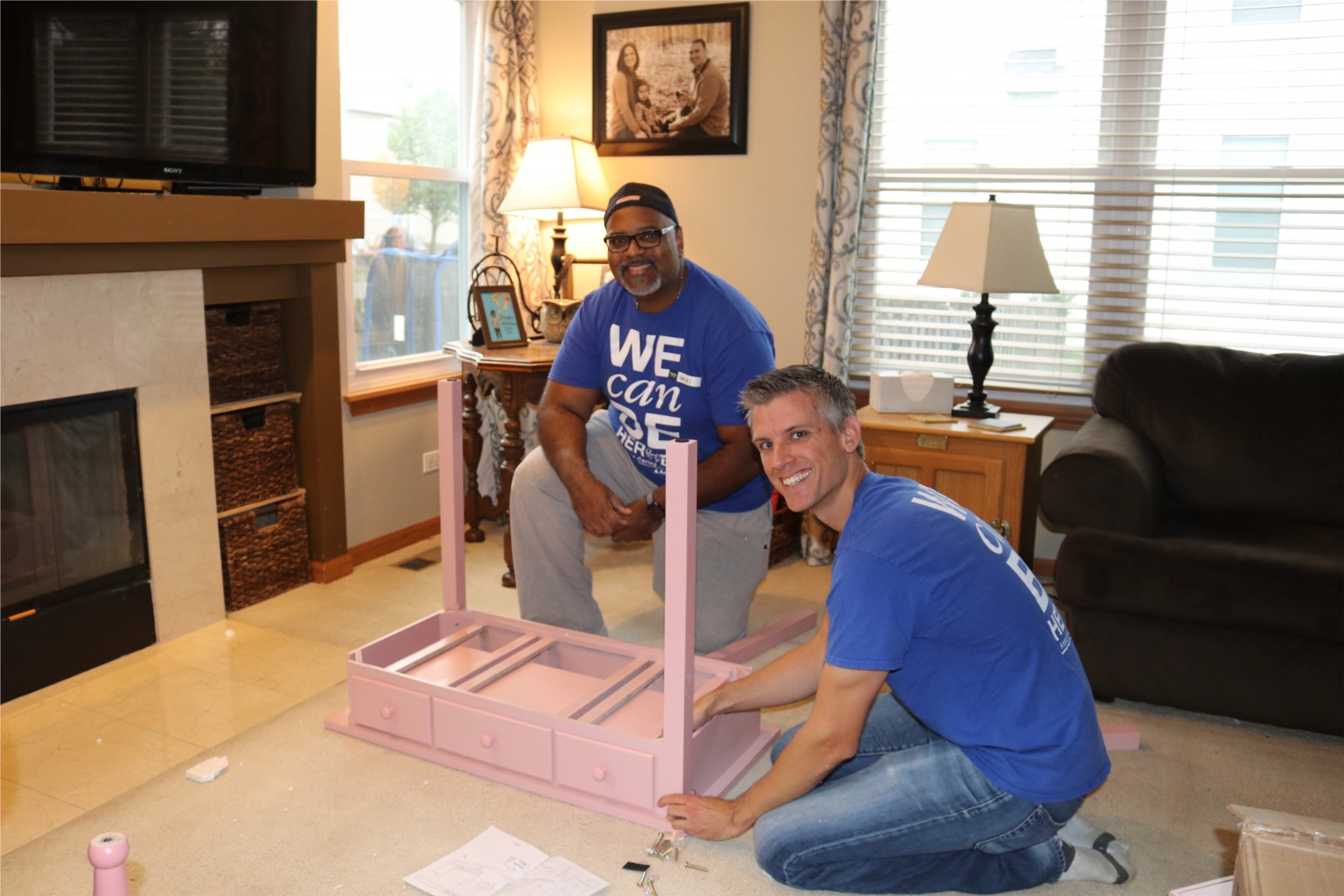 Assurance volunteers help build a dream bedroom for a terminally ill child through the Assurance Caring Together partnership with Special Spaces. 