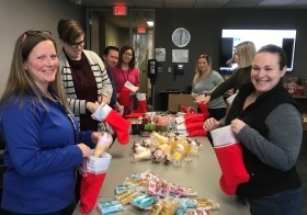 Our team got into the holiday spirit, stuffing stockings to be hung by the chimney with care. The gift bundles were assembled for parents and children who benefit from the services provided by Starfish Family Services.