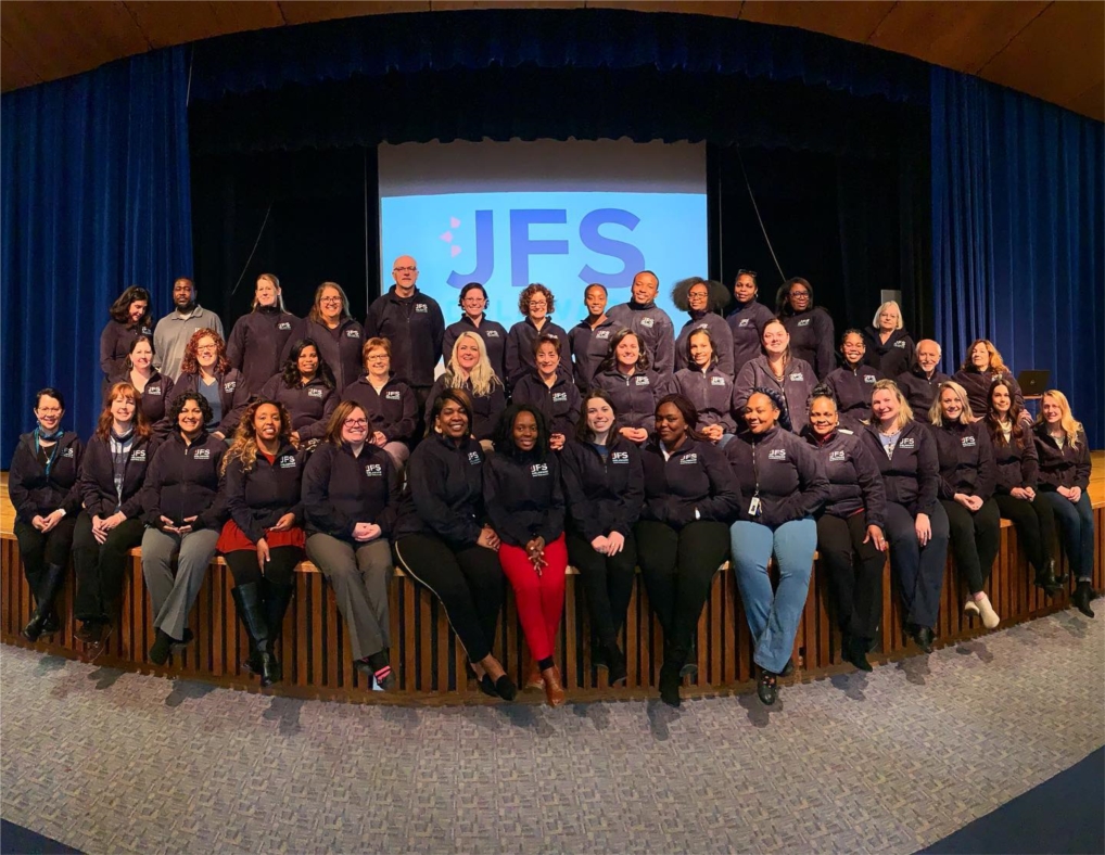 Staff were surprised at a January 2020 team meeting with JFS branded fleeces!
