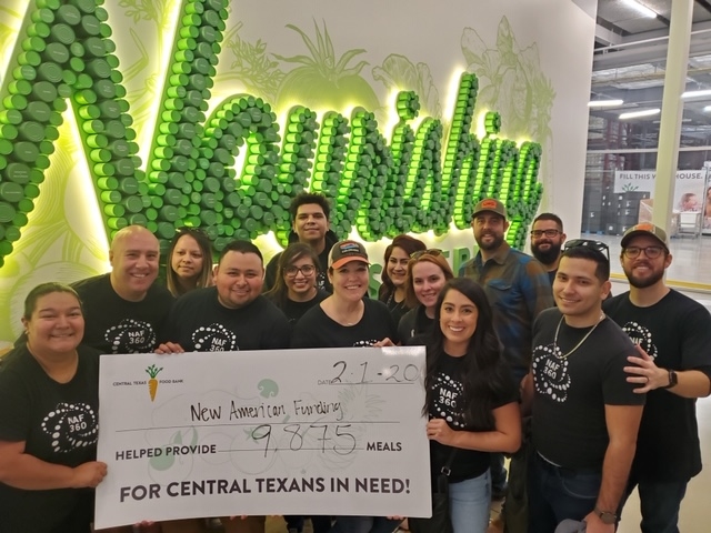 New American Funding's Austin Servicing team packaging meals for the Texas Area Capital Food Bank