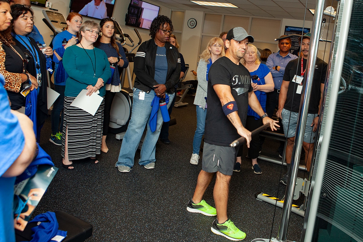 Team members at the grand opening of the new in-house fitness center.