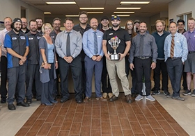 Michael Ballantyne at Young Hyundai receiving the Caught Being YAG trophy. The Caught Being YAG program recognizes employees who go out of their way to demonstrate the company's core values. 