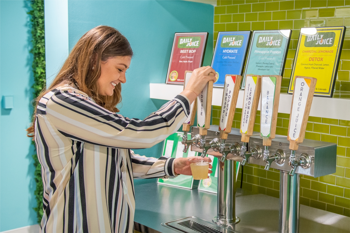 Perks at the RetailMeNot office in Austin include fresh Daily Juice on tap, catered lunches, and a coffee bar with full-service baristas. 
