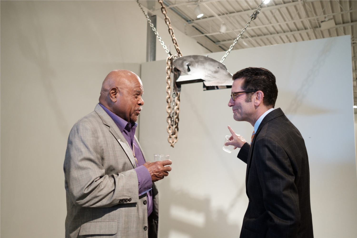 Internationally recognized sculptor Melvin Edwards and Oklahoma Contemporary Exhibitions Manager Steve Boyd chat at the opening of Edwards' exhibition, his first in the state in 25 years.