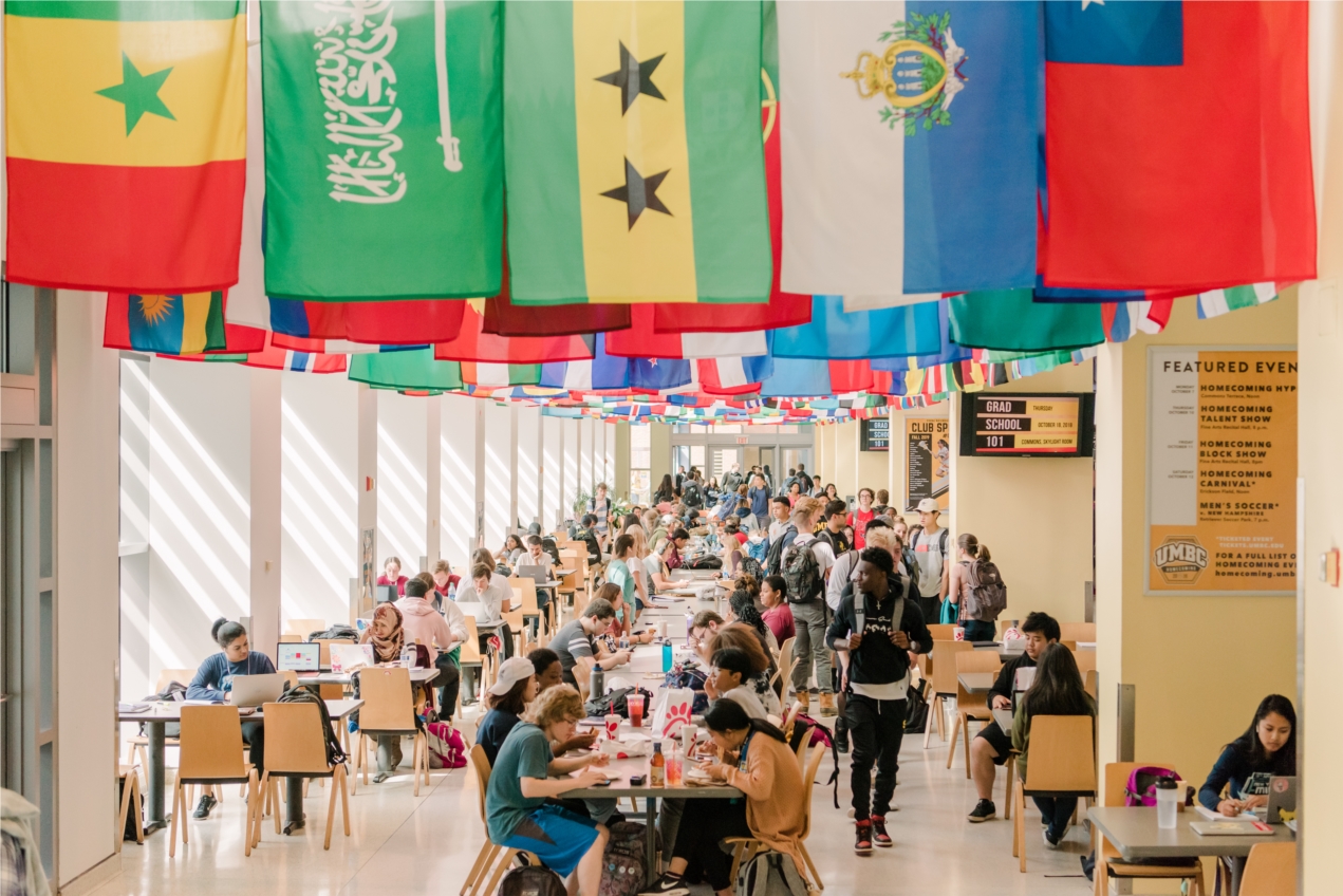 Students enjoy a meal in the Commons under flags from the more than 100 countries represented in UMBC's student population.