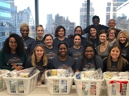 Glenmede employees volunteered with ACHIEVEability and prepared welcome home baskets for low-income families. 