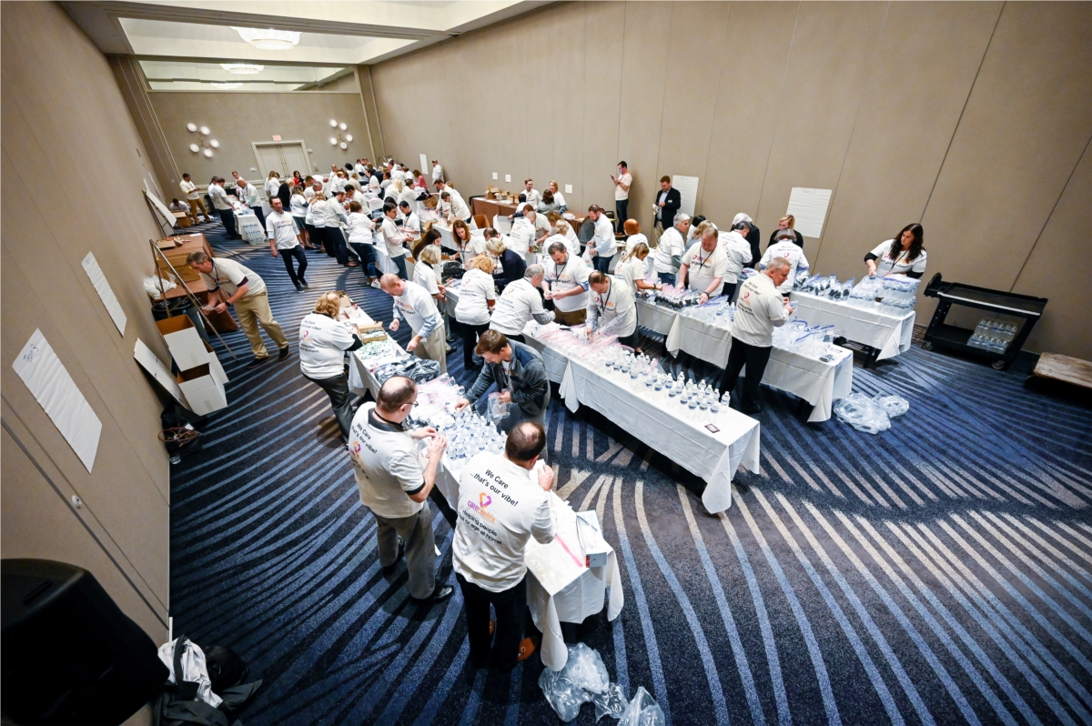 Approximately 100 CareCentrix leaders assembling and boxing over 1,000 hygiene bags for the Homeless in Tampa.