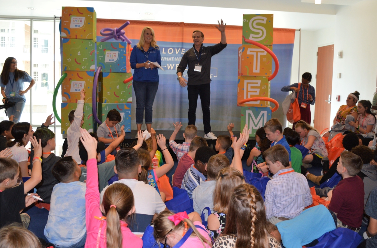 Kforce COO Kye Mitchell and CMO Andy Thomas engage students and their families at the firm's first Kforce Kids' STEM Fair in 2019. 