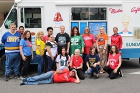 Staff celebrate Team Spirit Week in 2019 with an afternoon treat from Mister Softee and Team Jersey Day!