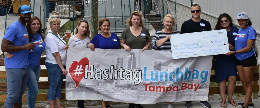 #Lunchbag Tampa Bay
Our team members volunteer to make sandwiches, pack hundreds of colorful bagged lunches, and deliver the food to the homeless at nearby parks.