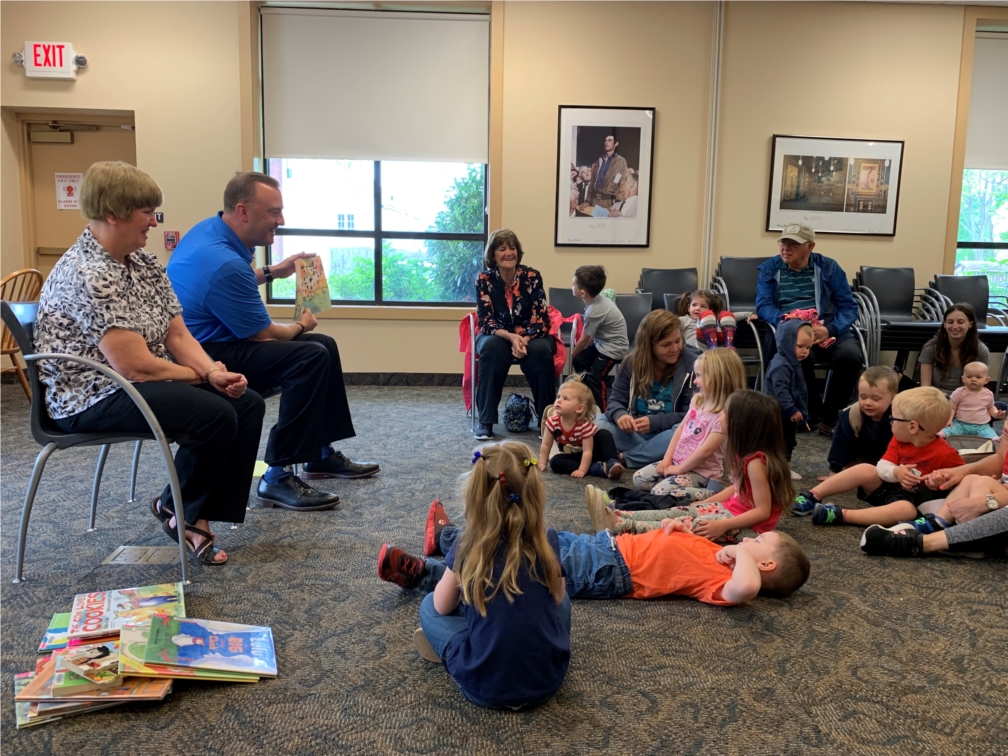 Jeff Schweitzer, President and CEO of Univest Financial, reads to children at a local library during Financial Literacy Month. 