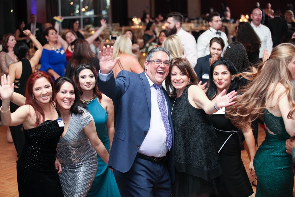 Co-workers having a great time celebrating HOMESTAR's success at our Annual Ball