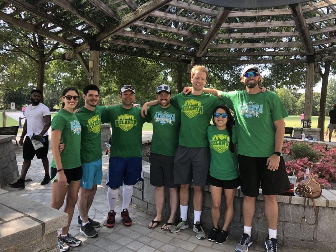 A group out of the Atlanta office pose after their kickball tournament.