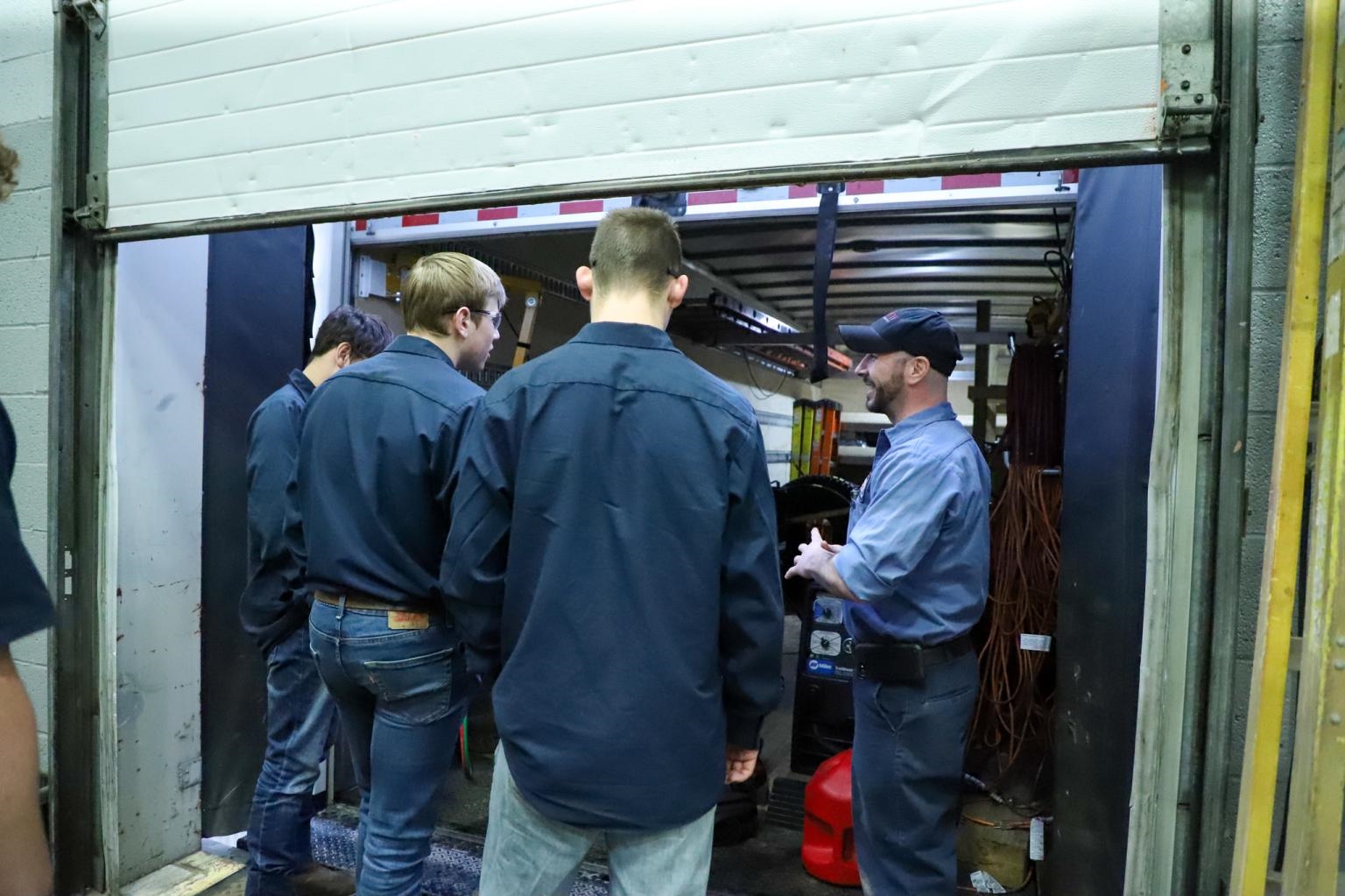 A group of local students lead a tour at our Jarrett Fleet Services location in Seville.