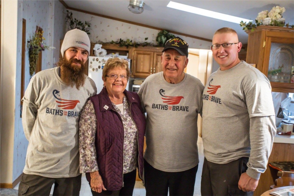 Installers Brad and Jesse take a moment to capture a photo with one of our Baths for the Brave recipients, Norman, and his wife Millie. 