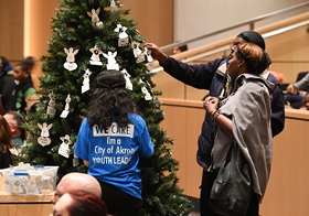 Family and friends gather every December to remember those lost to homicide by adorning one of 5 trees with with an angel ornament.