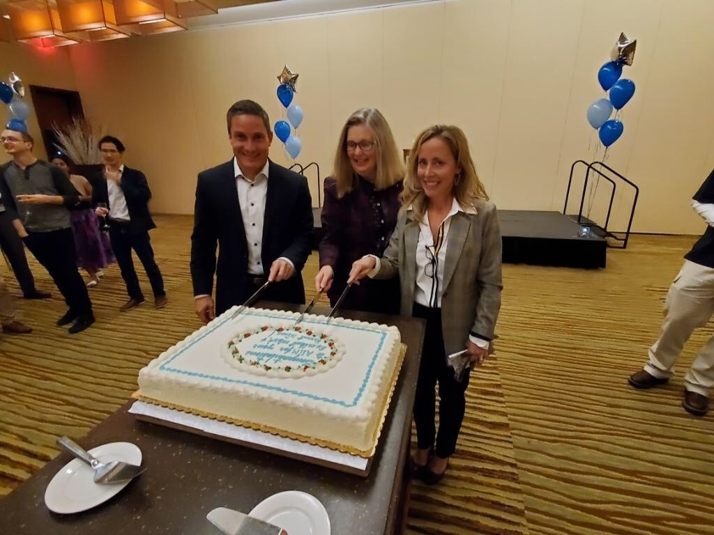 AEM executives cut the celebratory cake at a recent "major contract wins" reception.