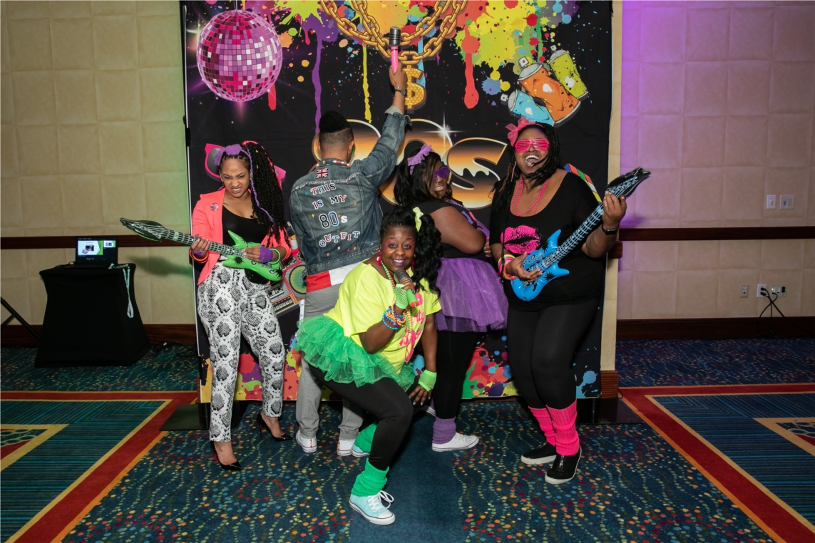 Atrium Hospitality Associates showing off their 1980's best at the kick-off party for the 2019 Annual Human Resources & Accounting Leaders Conference