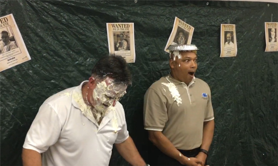 Employees donated money for a charity event and as a thank you got to throw pies at a co-worker.