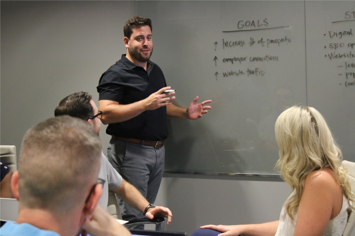 Senior account supervisor Eric Tieles leads the discussion during a brainstorm session inside the MP&F boardroom.