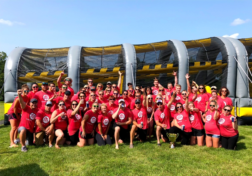 "Work hard, play hard!" is a phrase heard often around the Geneva office. Here, the team gathers to celebrate a sales goal achieved with a little fun in the sun! The reward: a day of outdoor fun complete with cocktails and an inflatable obstacle course at a nearby resort!