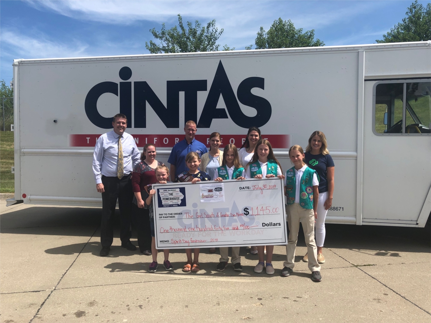 Cintas partners presenting a check to the Girl Scouts of Greater Iowa to assist with uniform and summer camp funding!