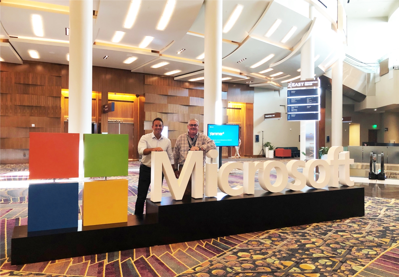At Blue Chip, all employees are presented with ongoing learning and development opportunities, including industry conferences. Pictured here are two employees at Microsoft's 2019 partner conference, Microsoft Inspire.